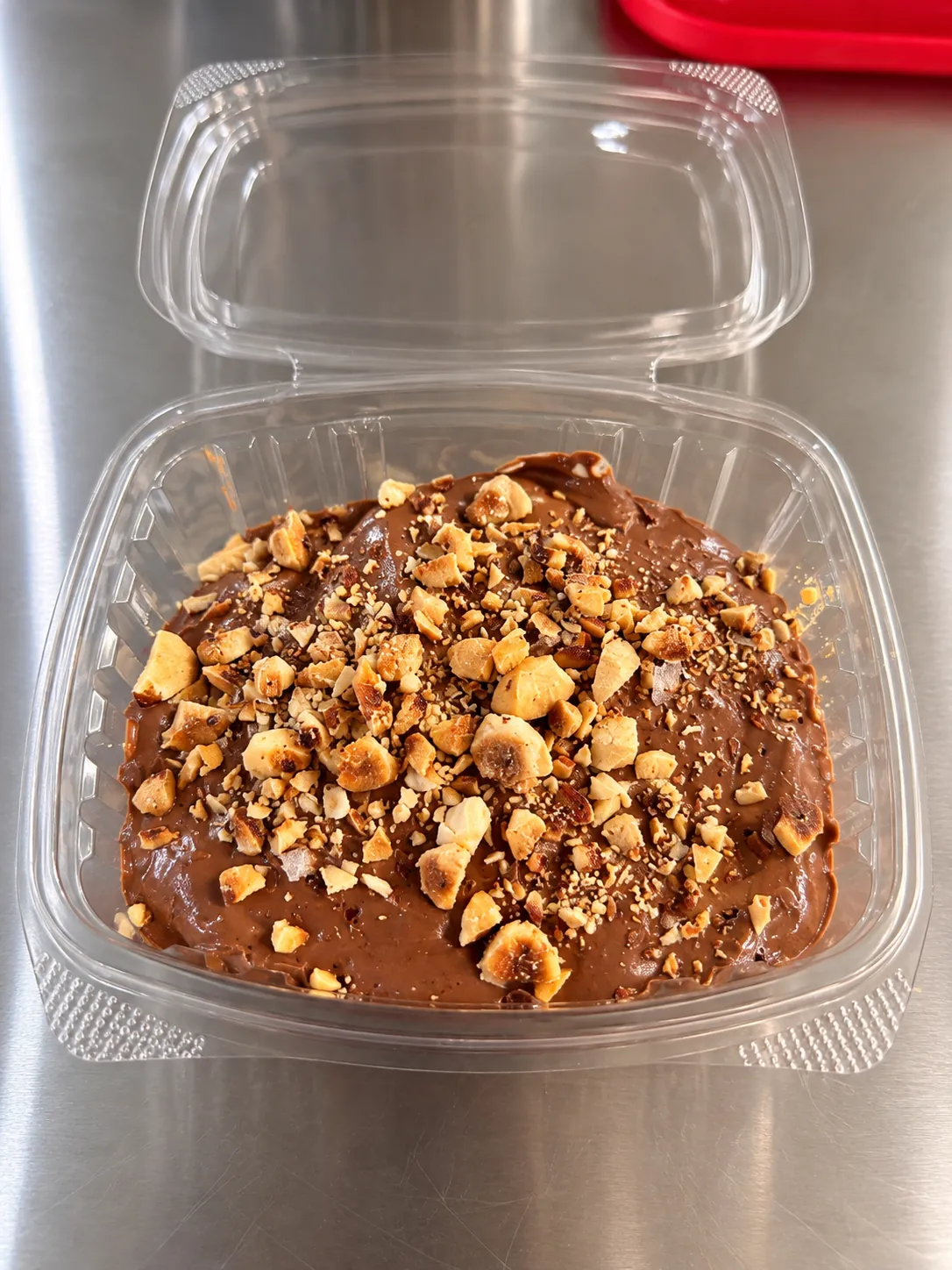 Creamy chocolate tofu protein pudding topped with toasted hazelnuts and Maldon sea salt.
