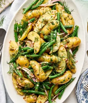 Mayo-free potato salad with green beans, fresh herbs, and tangy Dijon vinaigrette. not a real picture